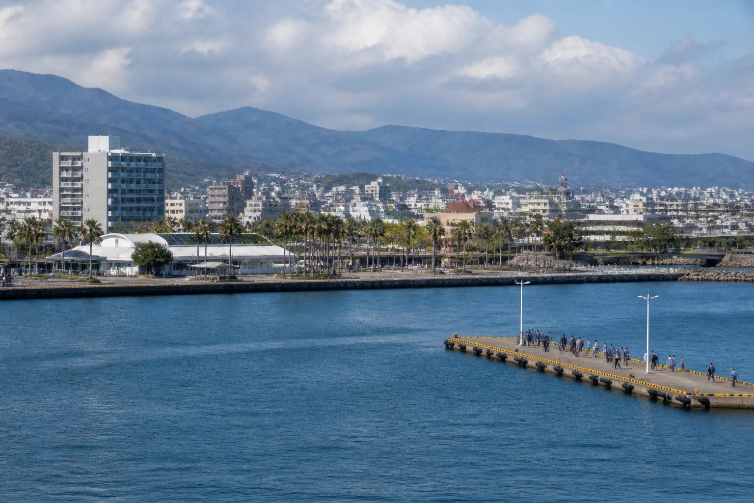 Representative cruise port destination view: Miyazaki, Japan; passenger waterfront and harbor water, not an exact landmark photograph.