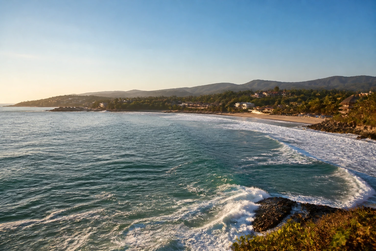 Representative coastal destination view: Puerto Escondido, Mexico; coastline and regional vegetation, not an exact landmark photograph.