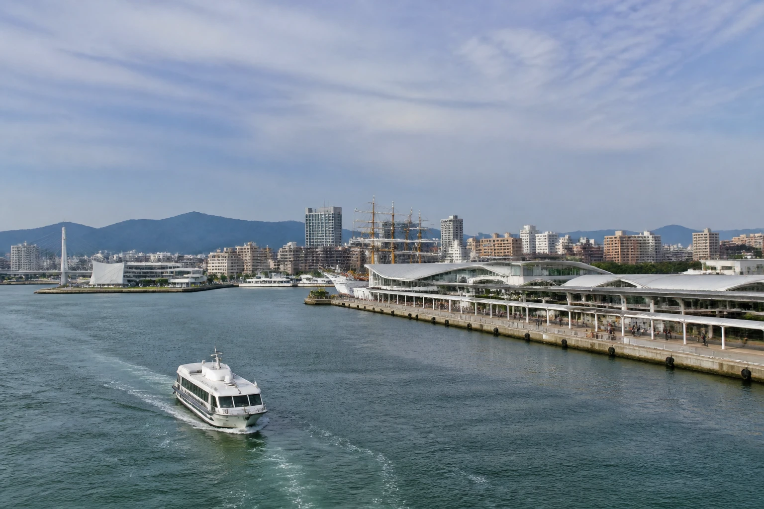 Representative cruise port destination view: Sendai, Japan; passenger waterfront and harbor water, not an exact landmark photograph.