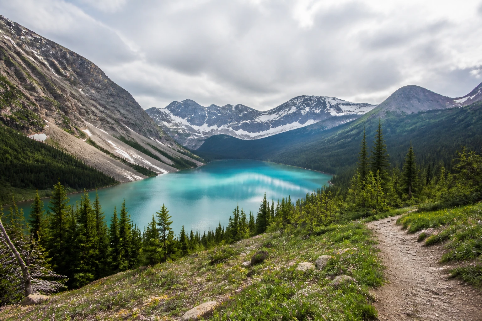 Representative national park destination view: Banff and Lake Louise, Canada; protected terrain and native vegetation, not an exact landmark photograph.
