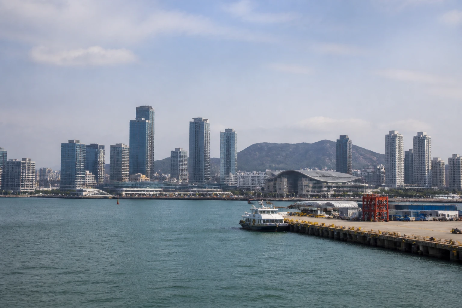 Representative cruise port destination view: Incheon, South Korea; passenger waterfront and harbor water, not an exact landmark photograph.