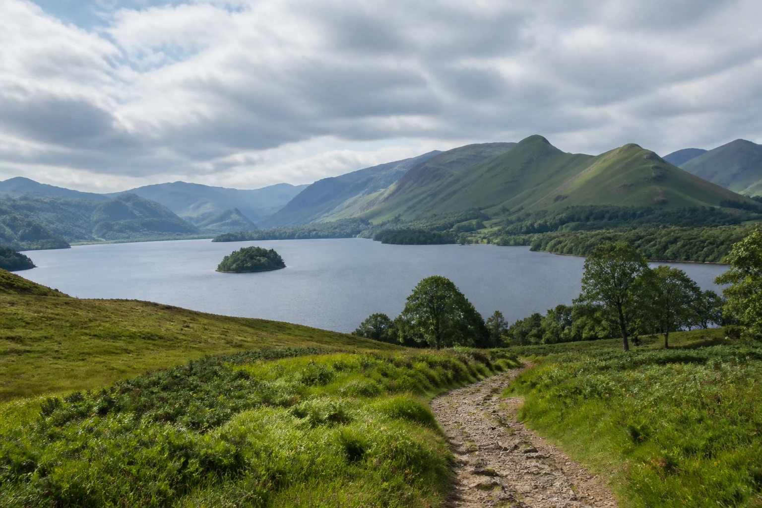 Representative national park destination view: Lake District, United Kingdom; protected terrain and native vegetation, not an exact landmark photograph.