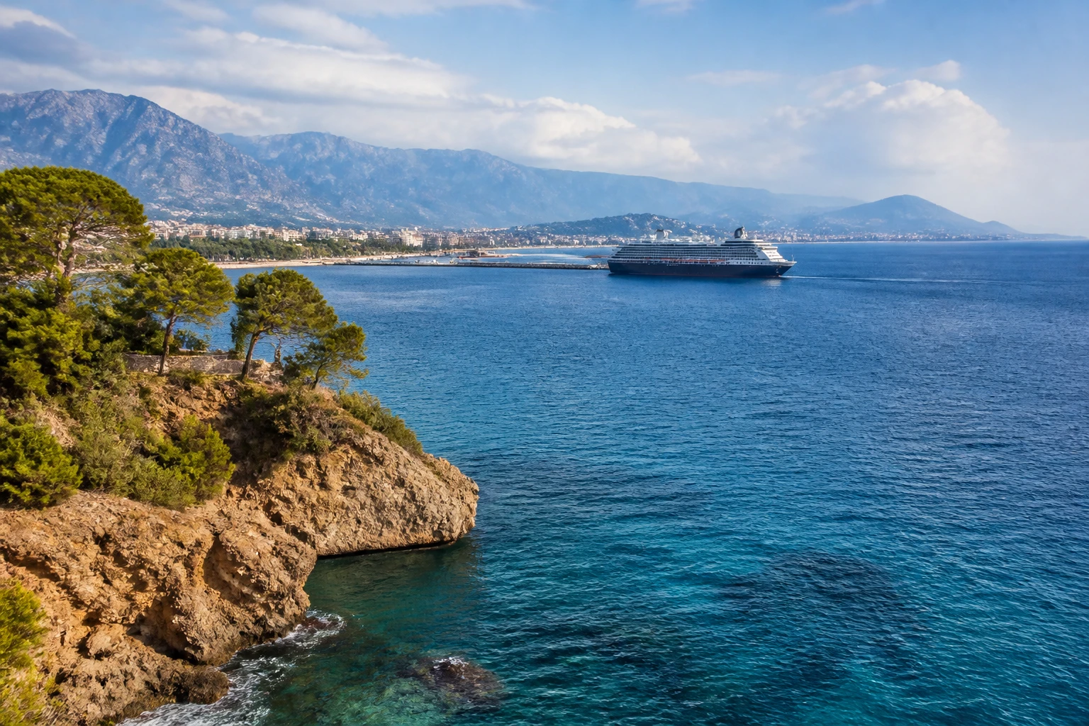 Representative coastal destination view: Antalya and the Turkish Riviera, Turkiye; coastline and regional vegetation, not an exact landmark photograph.
