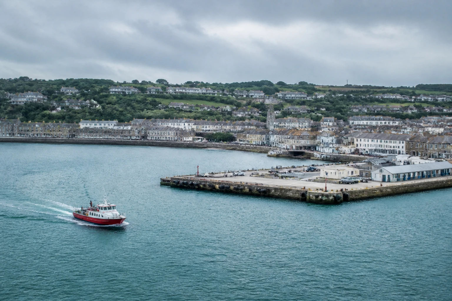 Representative cruise port destination view: Portland, United Kingdom; passenger waterfront and harbor water, not an exact landmark photograph.