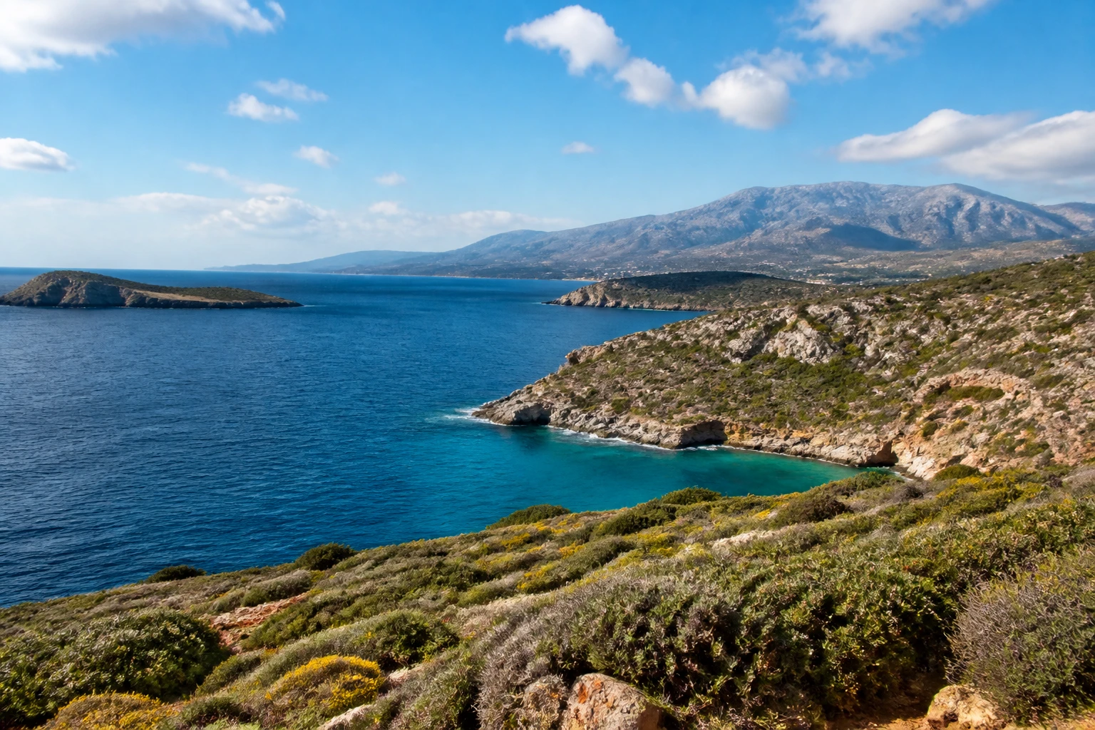 Representative island destination view: Crete, Greece; coastline and regional vegetation, not an exact landmark photograph.