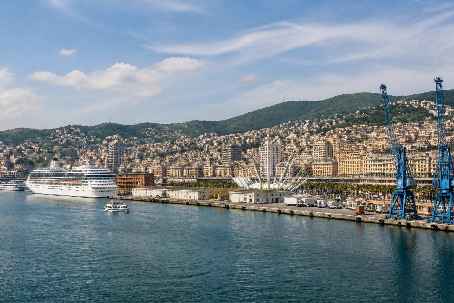 Representative cruise port destination view: Genoa, Italy; passenger waterfront and harbor water, not an exact landmark photograph.