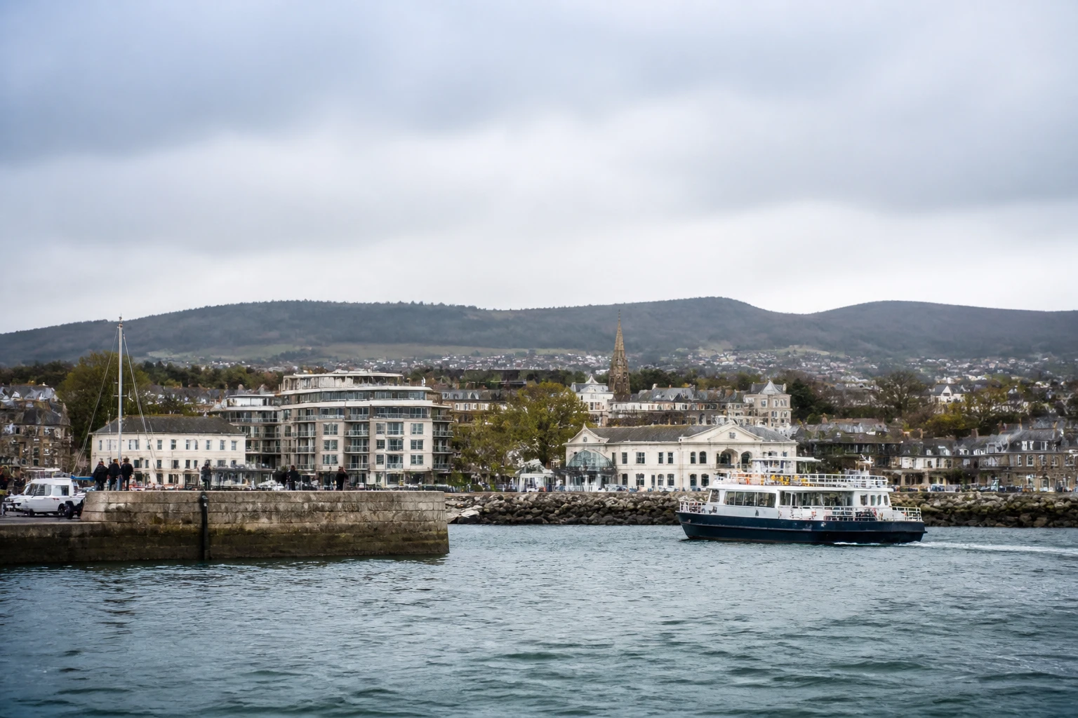 Representative cruise port destination view: Dun Laoghaire, Ireland; passenger waterfront and harbor water, not an exact landmark photograph.