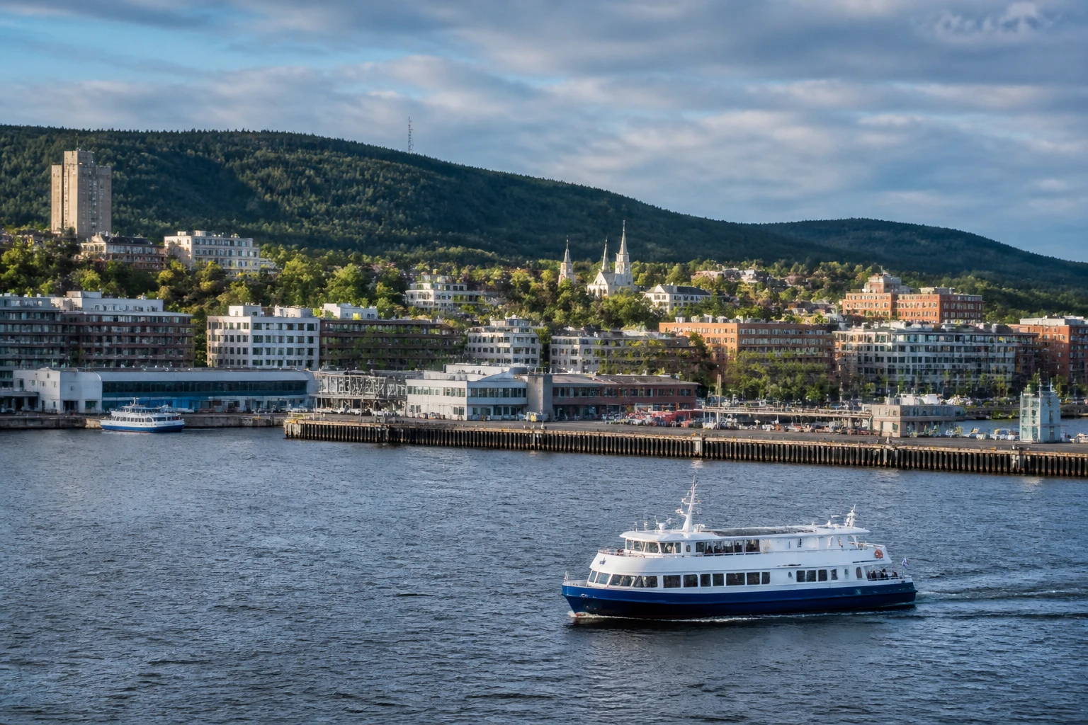 Representative cruise port destination view: Saguenay, Canada; passenger waterfront and harbor water, not an exact landmark photograph.
