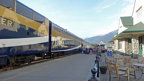 a Rocky Mountaineer train traveling through the Canadian Rockies, a destination or experience featured on the Great Resorts of the Canadian Rockies with Rocky Mountaineer tour