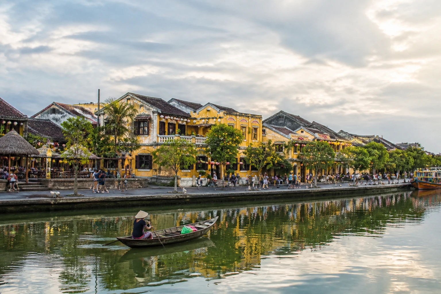 Representative historic city destination view: Hoi An, Vietnam; heritage-scale streetscape and regional architecture, not an exact landmark photograph.