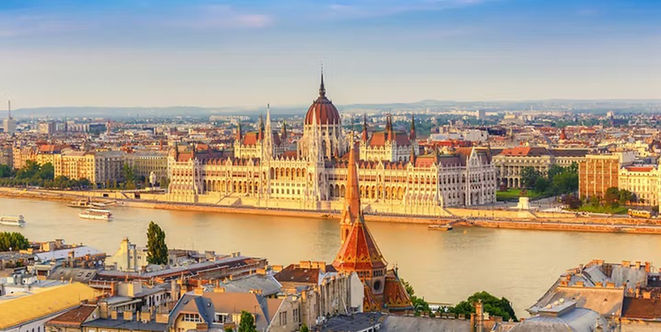 The Hungarian Parliament Building reflected in the Danube River in Budapest, Hungary.