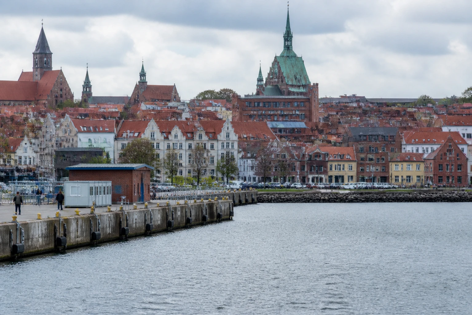 Representative cruise port destination view: Wismar, Germany; passenger waterfront and harbor water, not an exact landmark photograph.