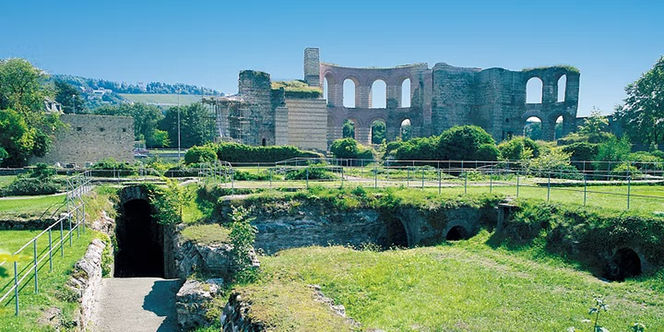 Preserved Roman stone ruins and archaeological grounds in Trier, Germany.