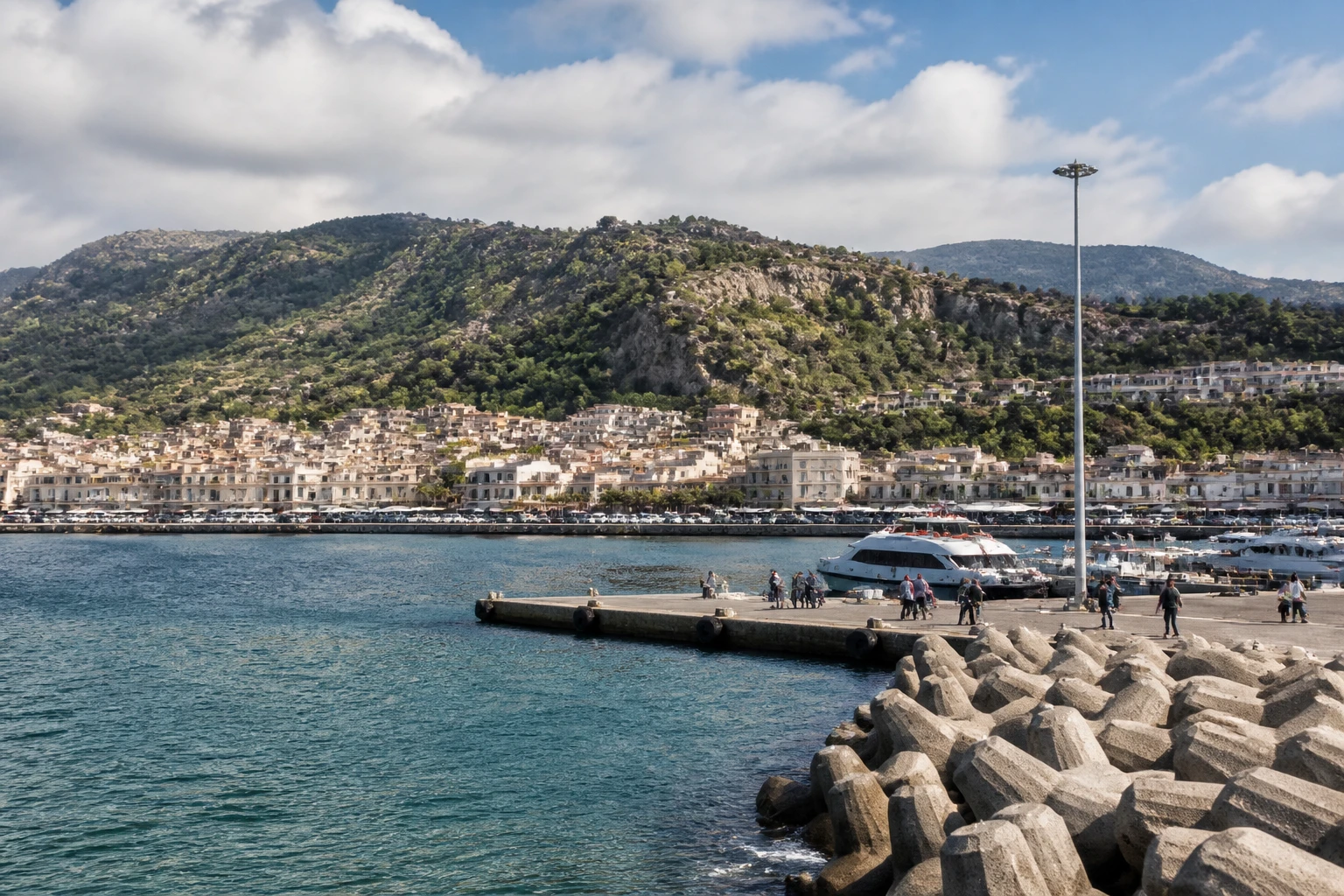 Representative cruise port destination view: Giardini Naxos, Italy; passenger waterfront and harbor water, not an exact landmark photograph.