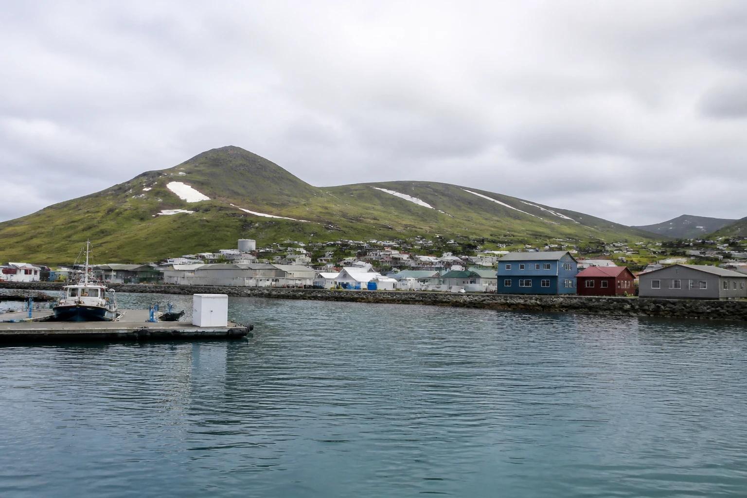 Representative cruise port destination view: Dutch Harbor, United States; passenger waterfront and harbor water, not an exact landmark photograph.