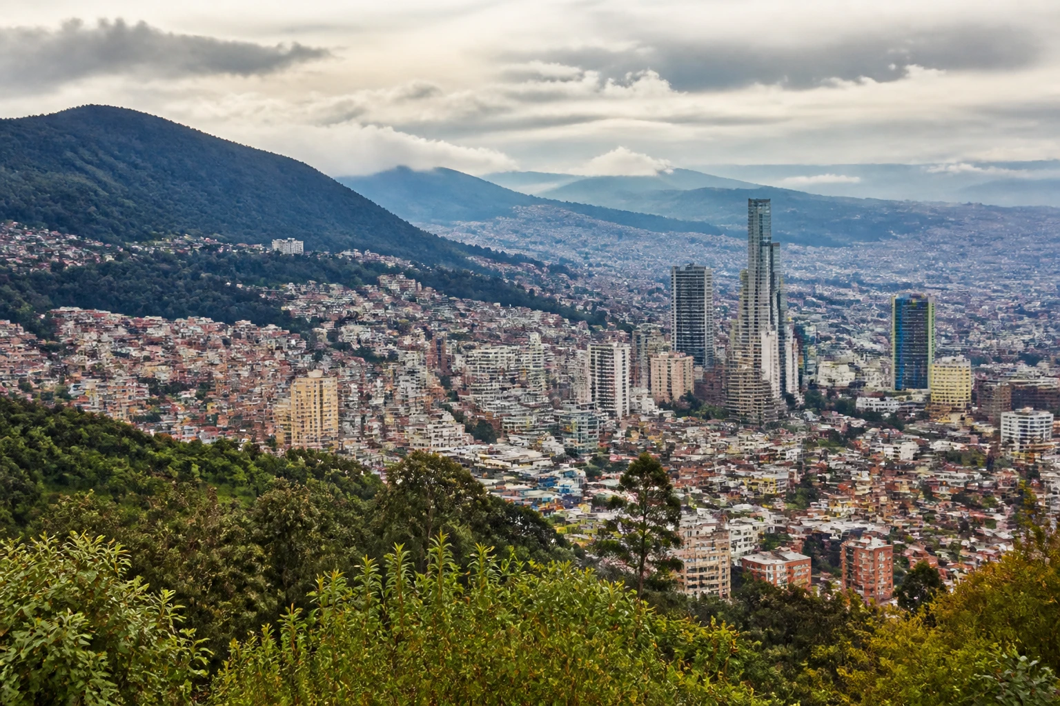Representative city destination view of Bogota in Colombia, with local streetscape, regional architecture, and natural light; not an exact landmark photograph.