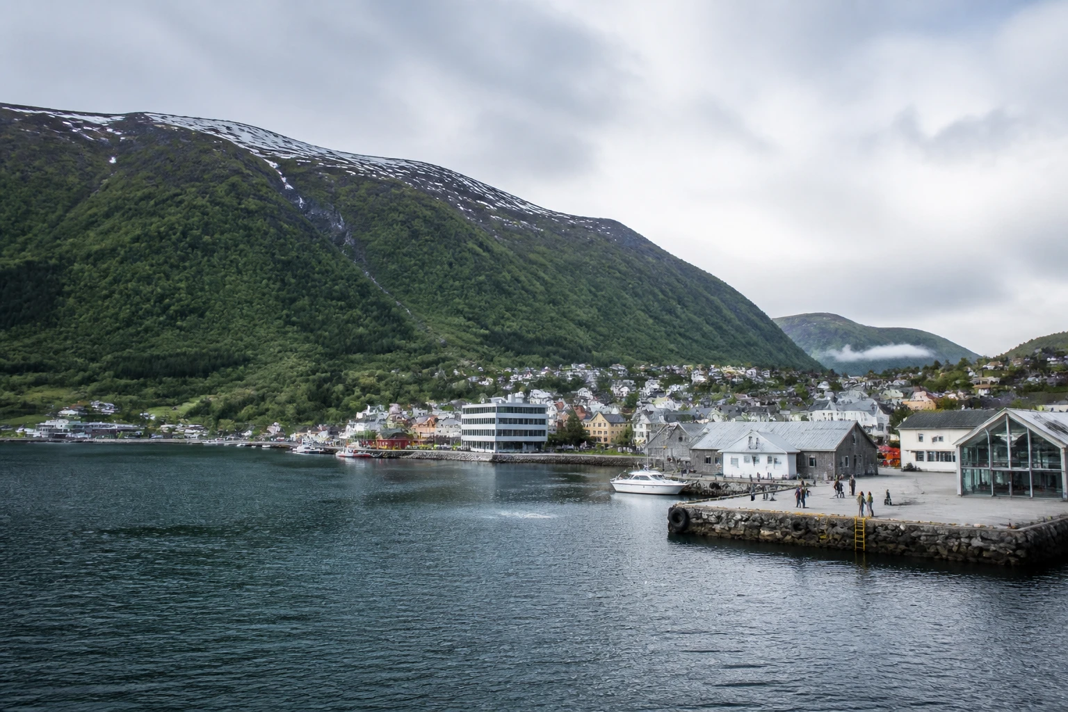 Representative cruise port destination view: Maloy, Norway; passenger waterfront and harbor water, not an exact landmark photograph.