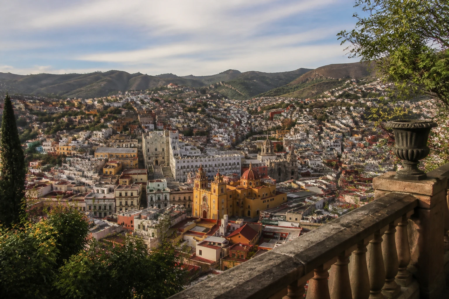 Representative historic city destination view: Guanajuato, Mexico; heritage-scale streetscape and regional architecture, not an exact landmark photograph.