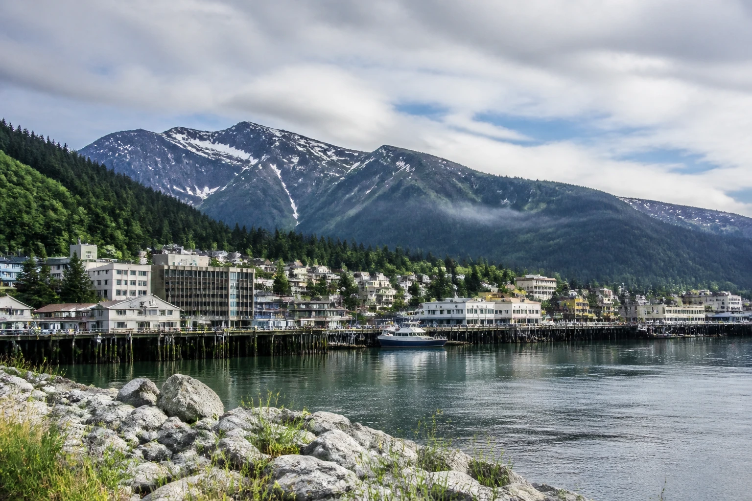 Representative city destination view: Juneau, United States; passenger waterfront and harbor water, not an exact landmark photograph.