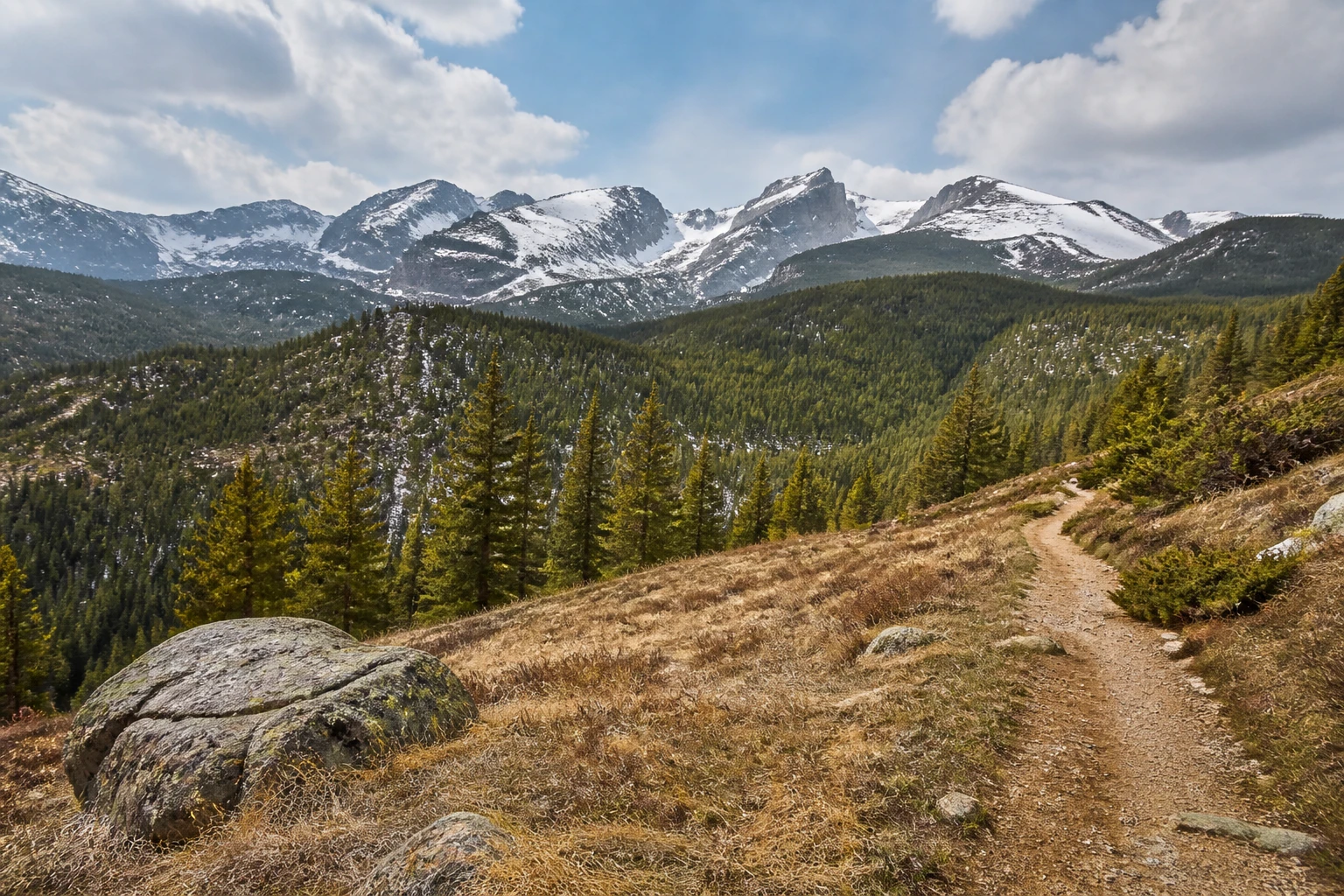 Representative national park destination view: Rocky Mountain National Park, United States; protected terrain and native vegetation, not an exact landmark photograph.