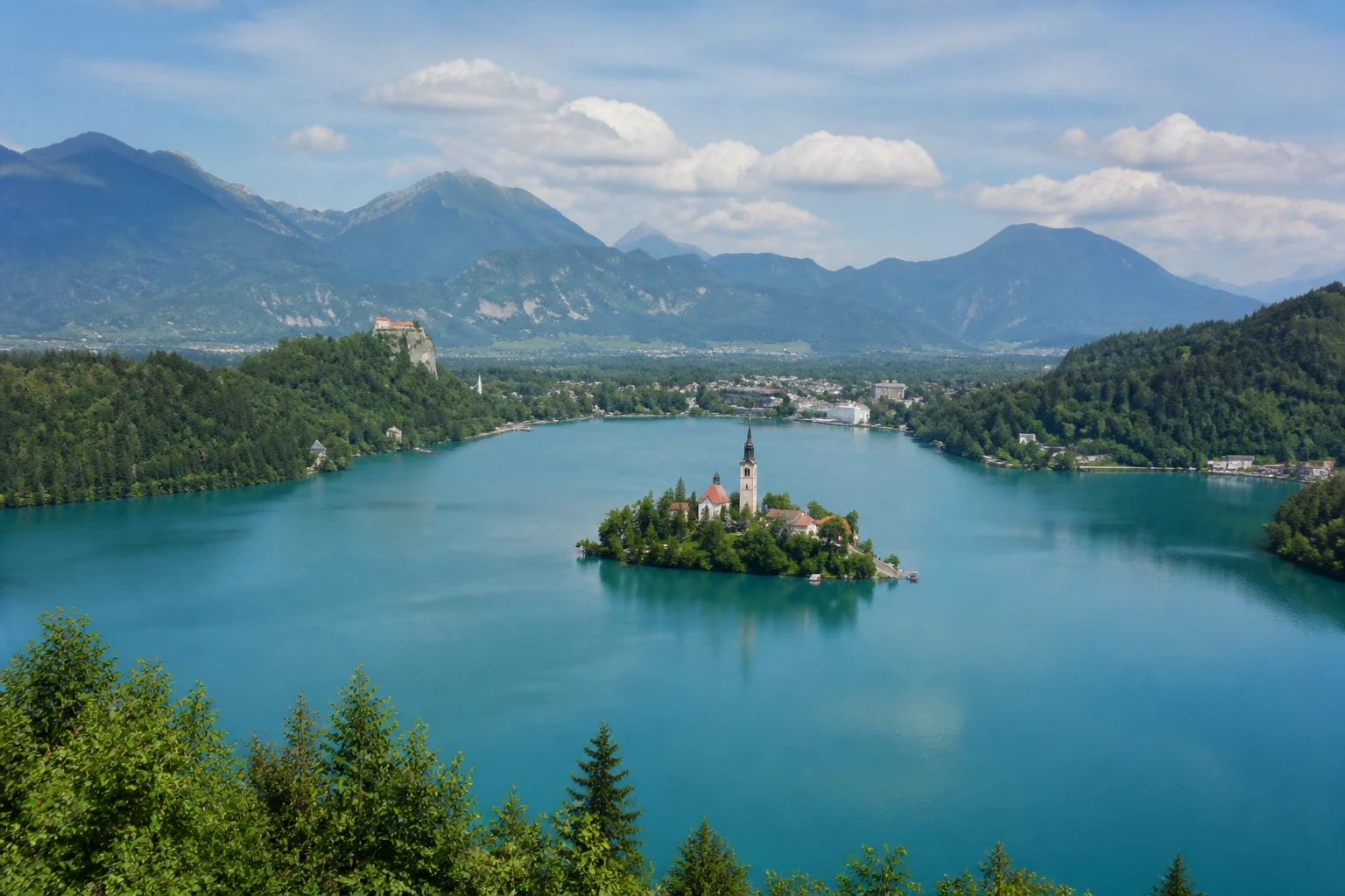 Representative lake destination view: Lake Bled, Slovenia; inland water, regional terrain, and vegetation, not an exact landmark photograph.