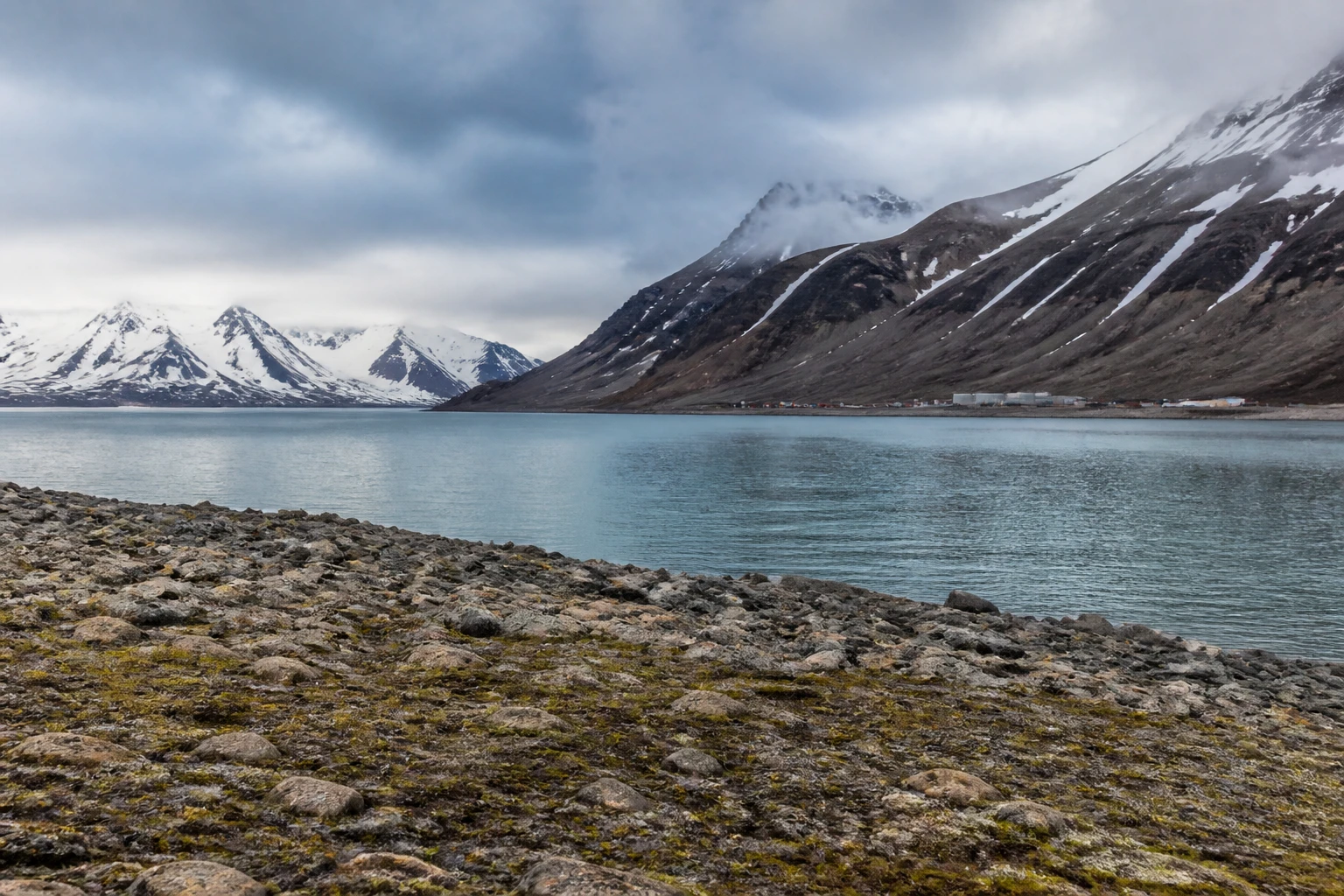 Representative cruise port destination view: Spitsbergen Island, Norway; coastline and regional vegetation, not an exact landmark photograph.