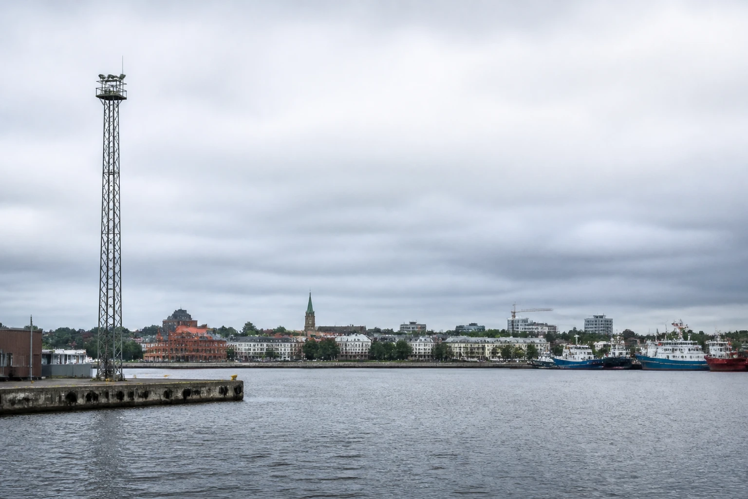 Representative cruise port destination view: Liepāja, Latvia; passenger waterfront and harbor water, not an exact landmark photograph.