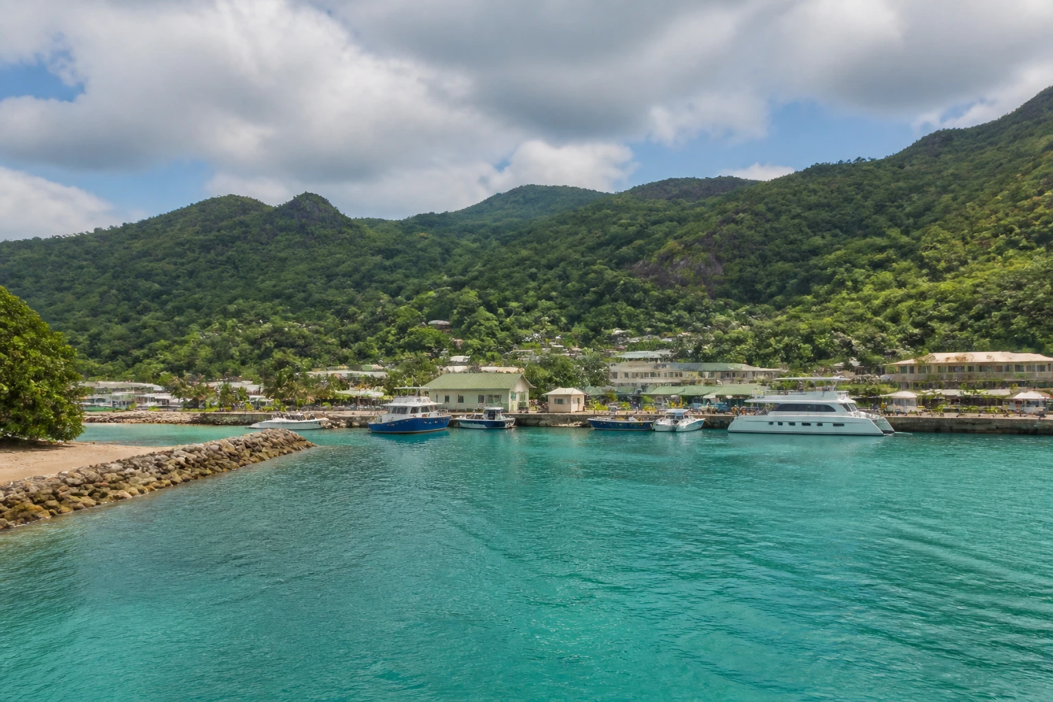 Representative cruise port destination view: Praslin, Seychelles; passenger waterfront and harbor water, not an exact landmark photograph.