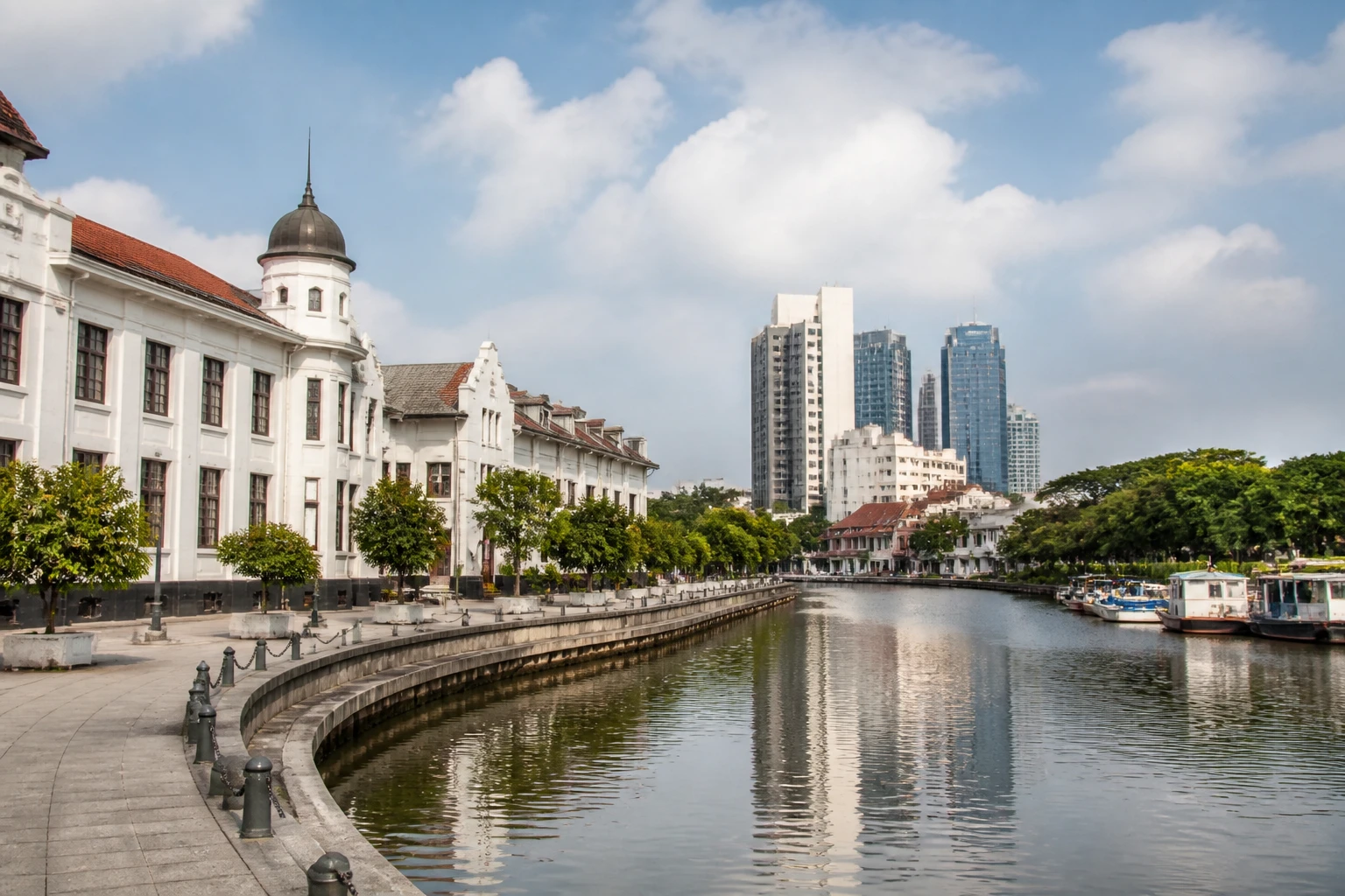 Representative city destination view: Jakarta, Indonesia; passenger waterfront and harbor water, not an exact landmark photograph.