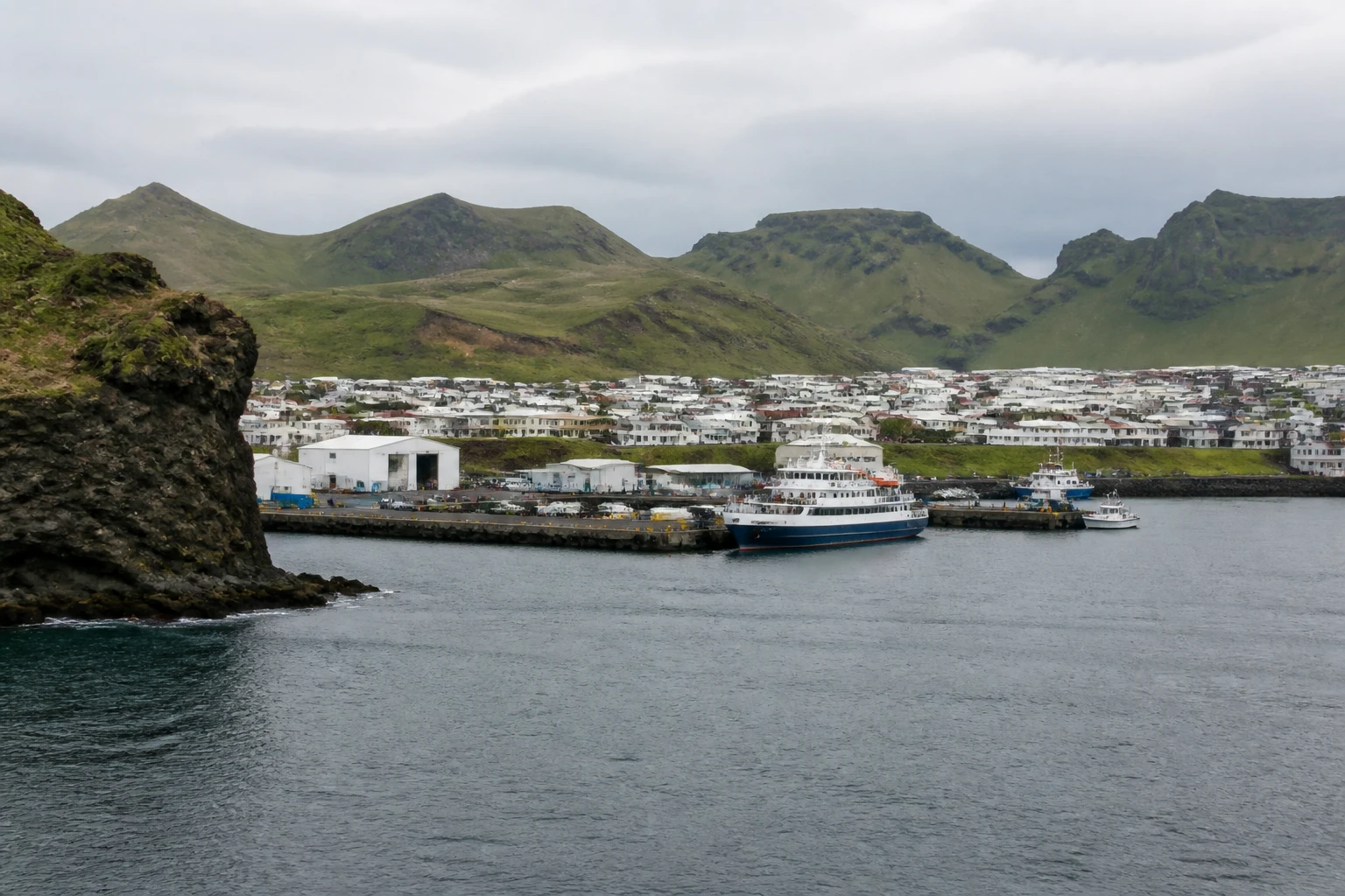 Representative cruise port destination view: Heimaey, Iceland; passenger waterfront and harbor water, not an exact landmark photograph.