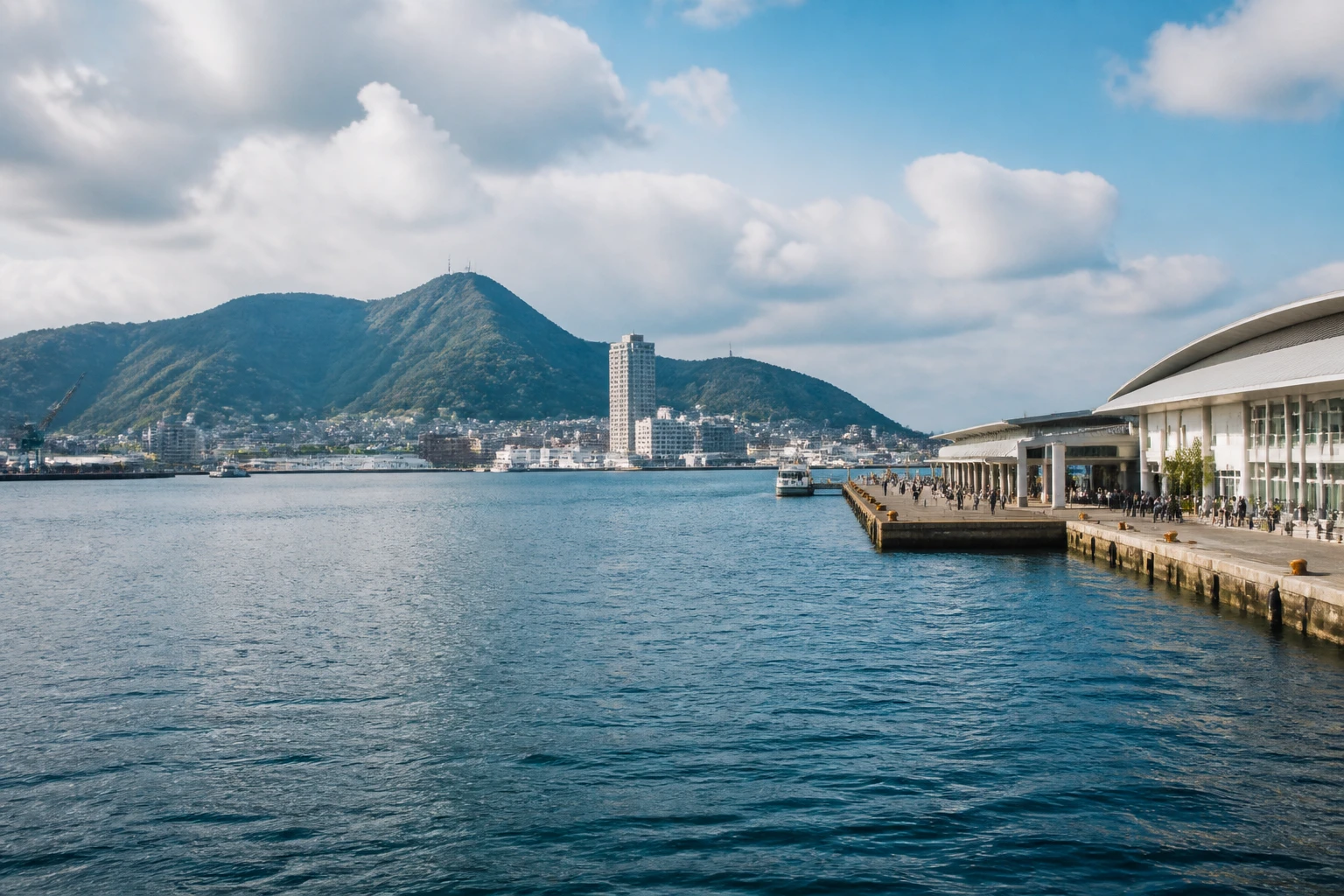 Representative cruise port destination view: Shimonoseki, Japan; passenger waterfront and harbor water, not an exact landmark photograph.