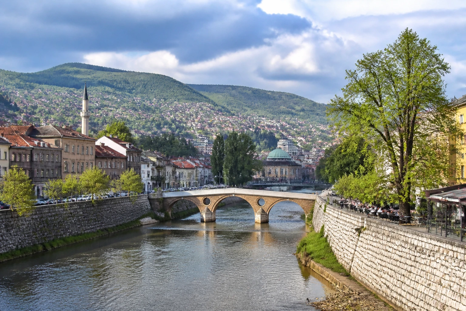 Representative historic city destination view of Sarajevo in Bosnia and Herzegovina, with heritage-scale streetscape, regional architecture, and natural light; not an exact landmark photograph.