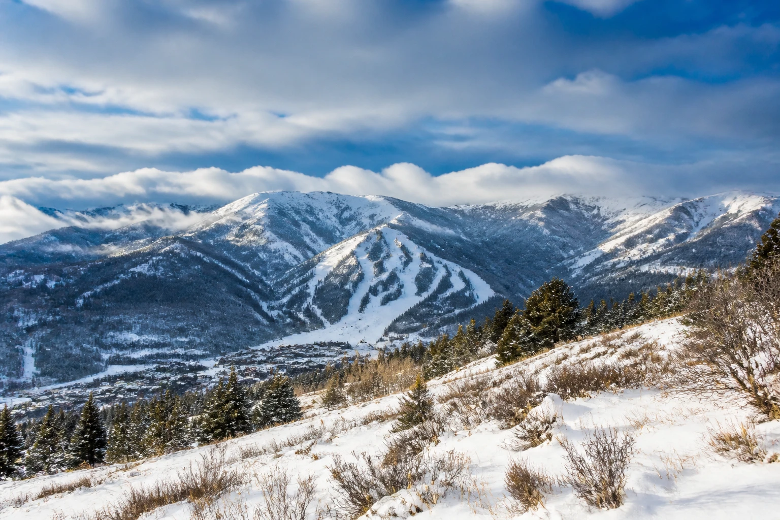 Representative mountain destination view: Park City, United States; mountain or canyon terrain and regional vegetation, not an exact landmark photograph.