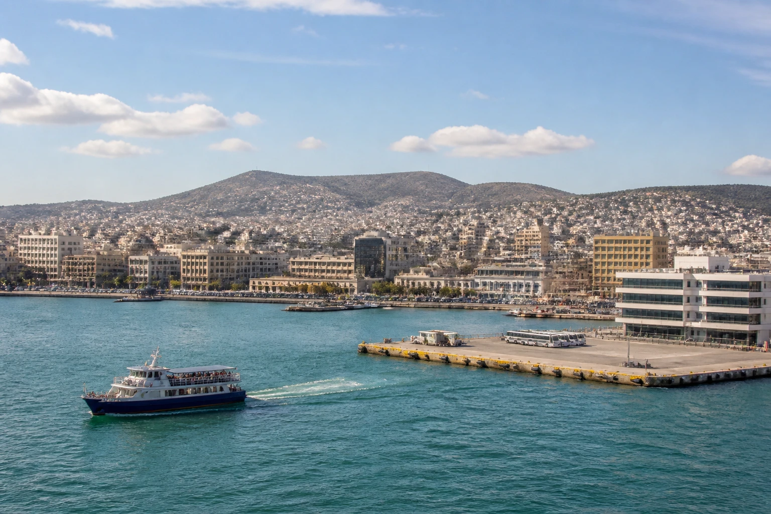 Representative cruise port destination view: Piraeus, Greece; passenger waterfront and harbor water, not an exact landmark photograph.