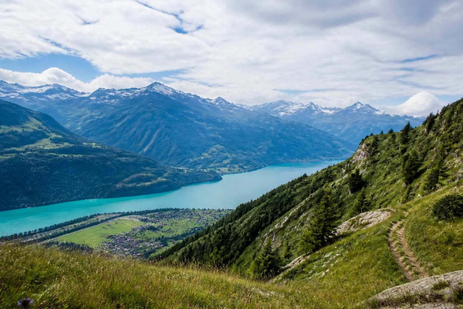 Representative mountain destination view: Interlaken, Switzerland; mountain or canyon terrain and regional vegetation, not an exact landmark photograph.