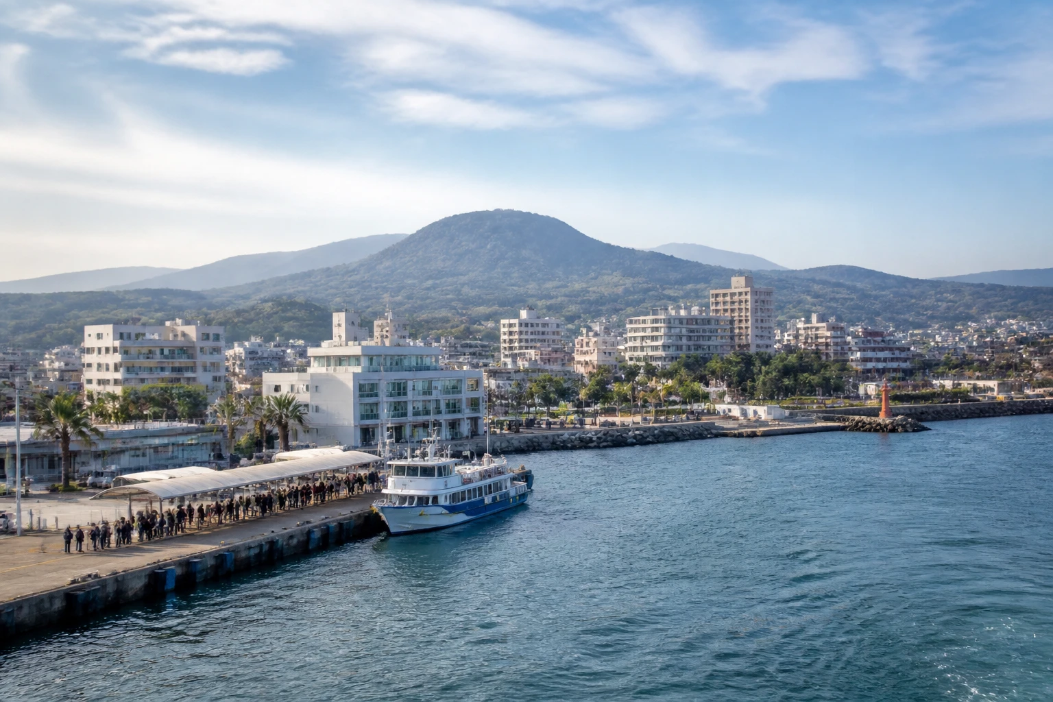 Representative cruise port destination view: Seogwipo City, South Korea; passenger waterfront and harbor water, not an exact landmark photograph.