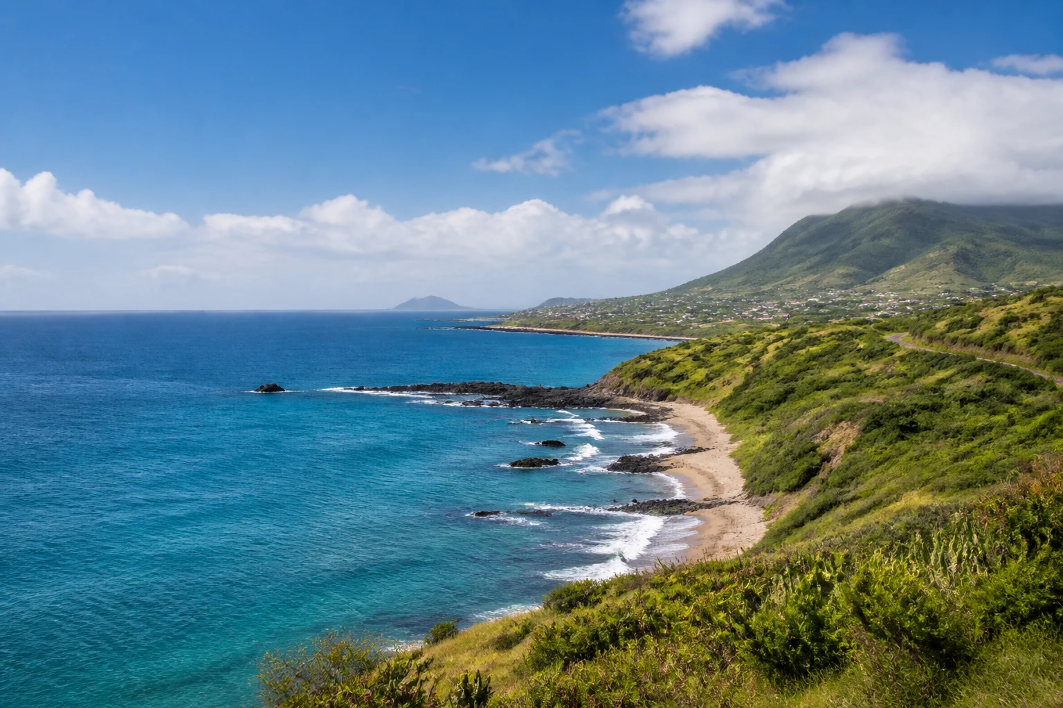 Representative island destination view: Saint Kitts; coastline and regional vegetation, not an exact landmark photograph.