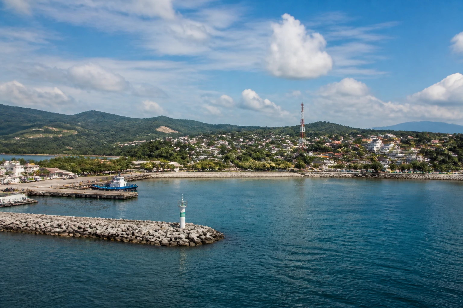 Representative cruise port destination view: Puerto Chiapas, Mexico; passenger waterfront and harbor water, not an exact landmark photograph.