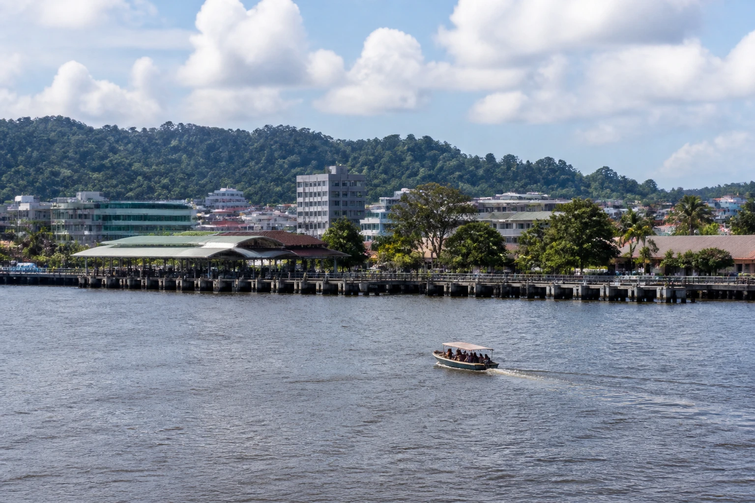 Representative cruise port destination view: Muara, Brunei; passenger waterfront and harbor water, not an exact landmark photograph.