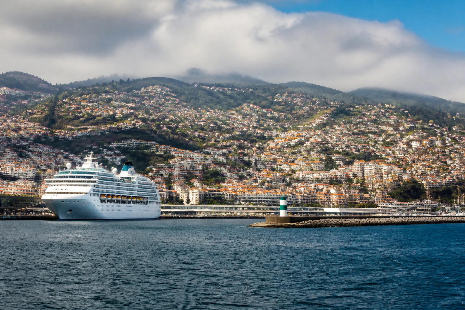 Representative cruise port destination view: Funchal, Portugal; passenger waterfront and harbor water, not an exact landmark photograph.