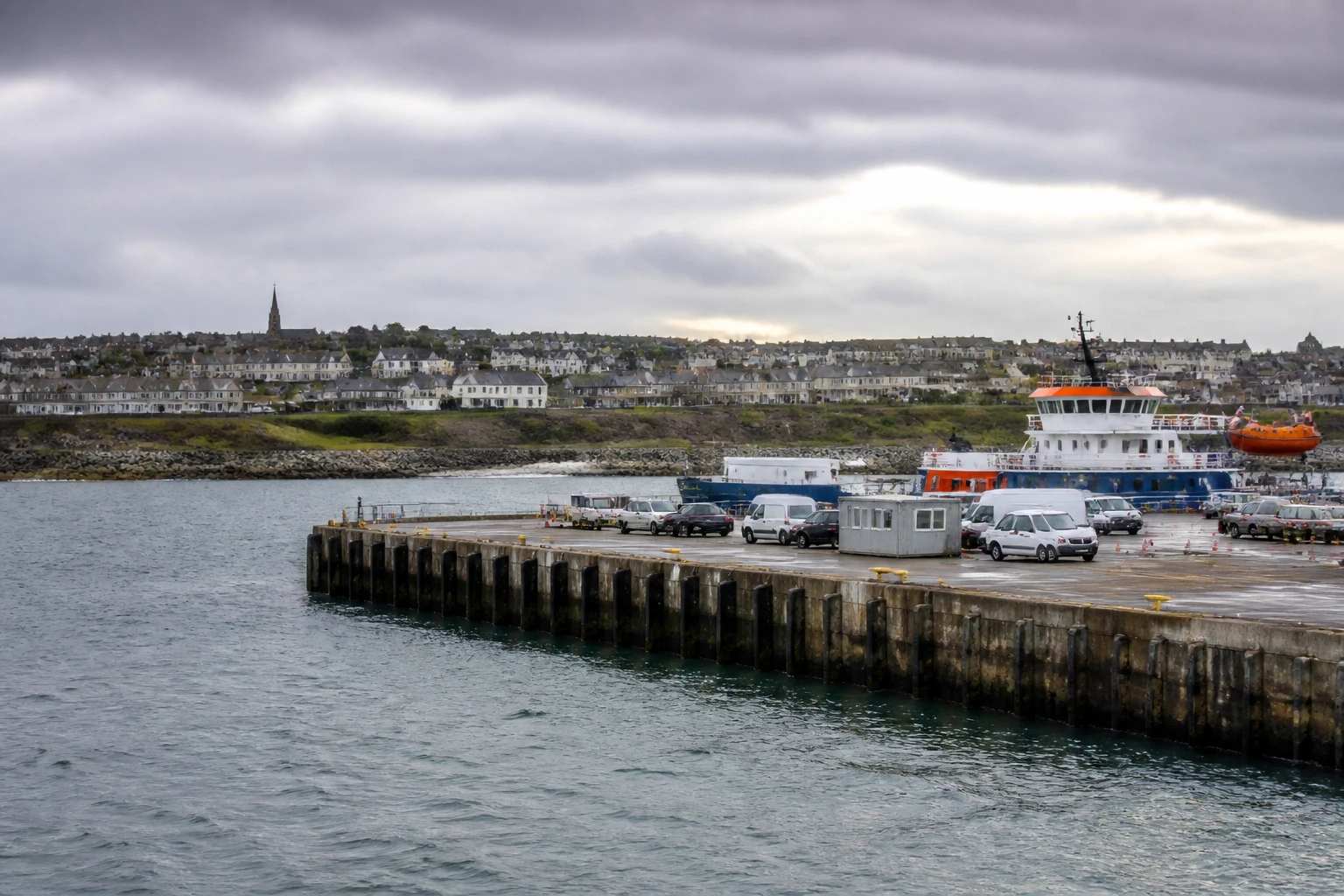 Representative cruise port destination view: Scrabster, United Kingdom; passenger waterfront and harbor water, not an exact landmark photograph.