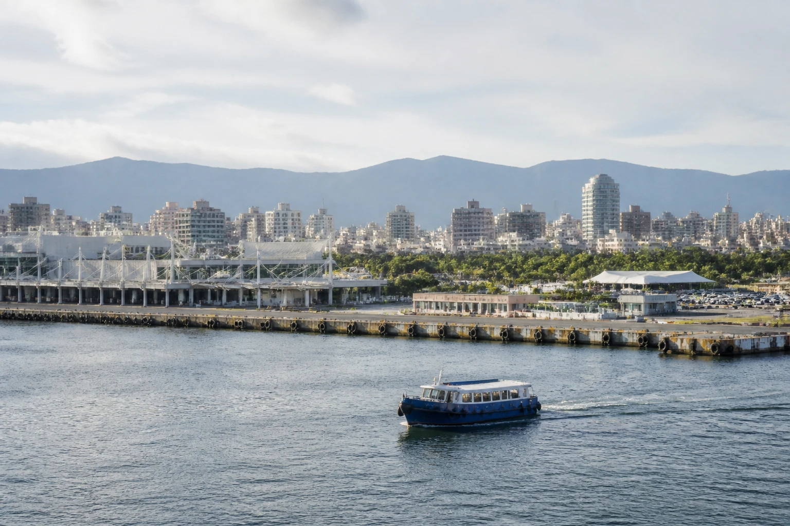 Representative cruise port destination view: Tainan, Taiwan; passenger waterfront and harbor water, not an exact landmark photograph.