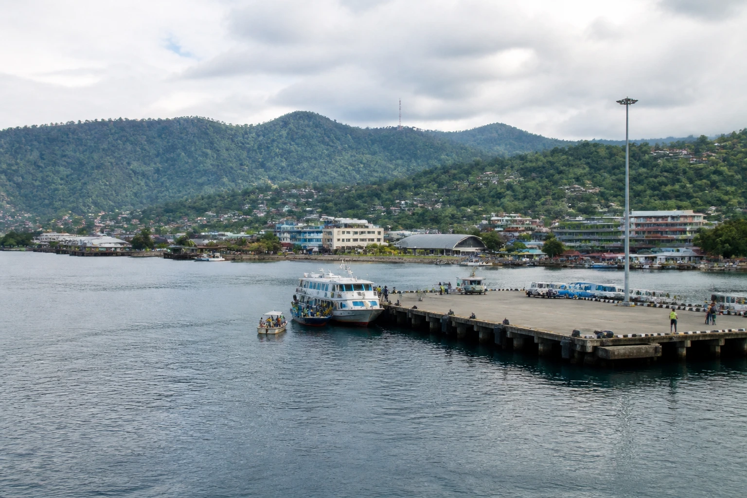 Representative cruise port destination view: Jayapura, Indonesia; passenger waterfront and harbor water, not an exact landmark photograph.