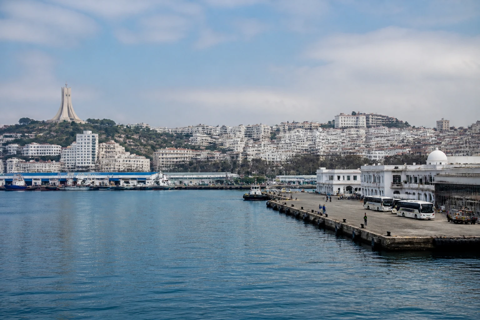 Representative cruise port destination view: Algiers, Algeria; passenger waterfront and harbor water, not an exact landmark photograph.