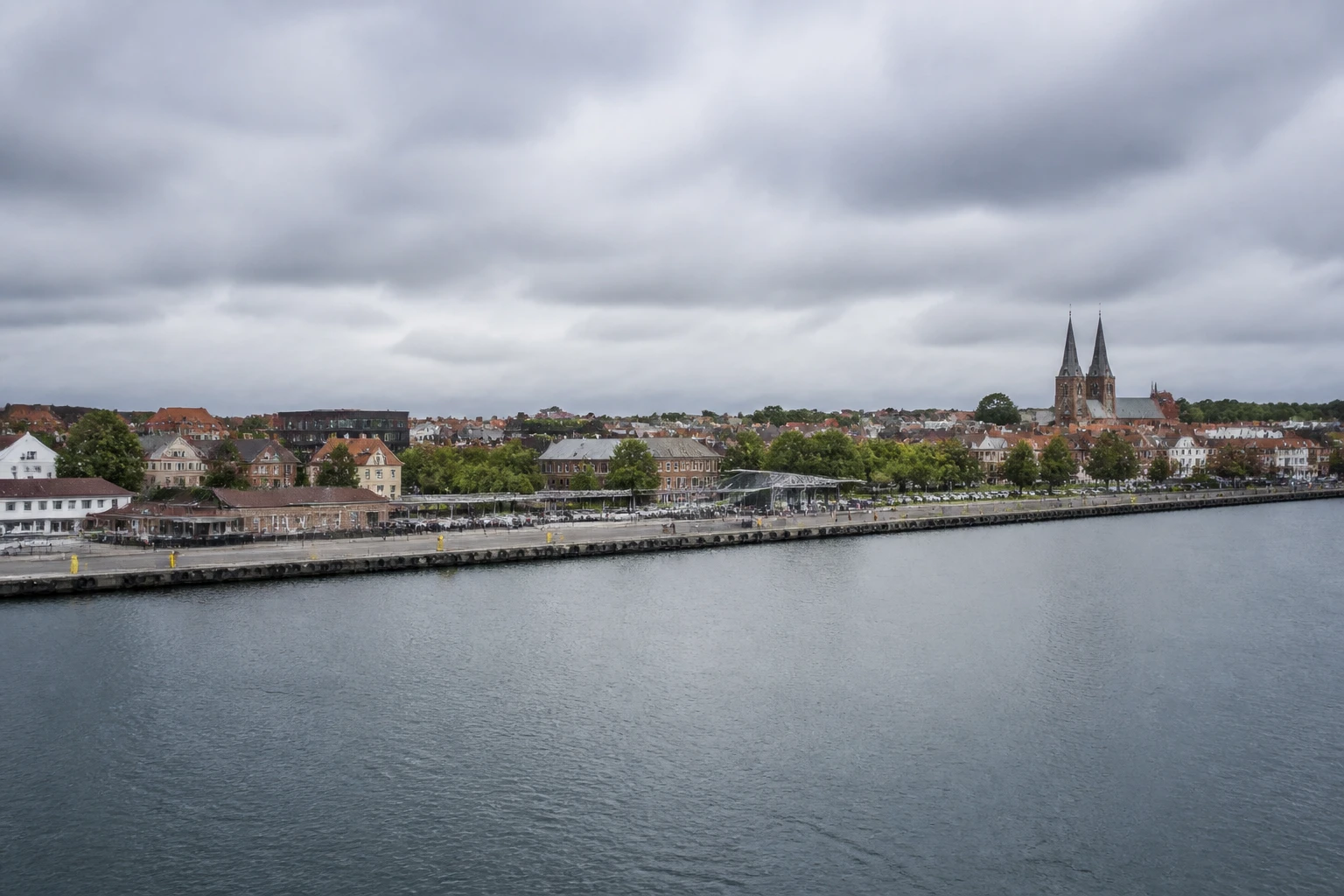 Representative cruise port destination view: Kalundborg, Denmark; passenger waterfront and harbor water, not an exact landmark photograph.
