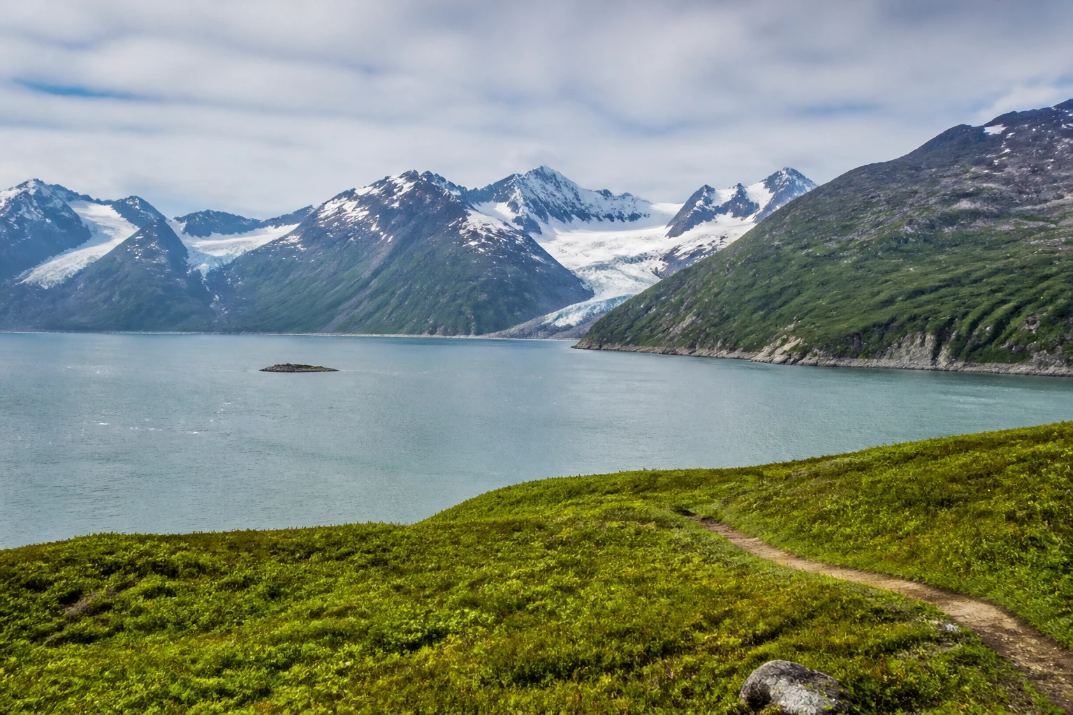 Representative national park destination view: Seward and Kenai Fjords, United States; protected terrain and native vegetation, not an exact landmark photograph.