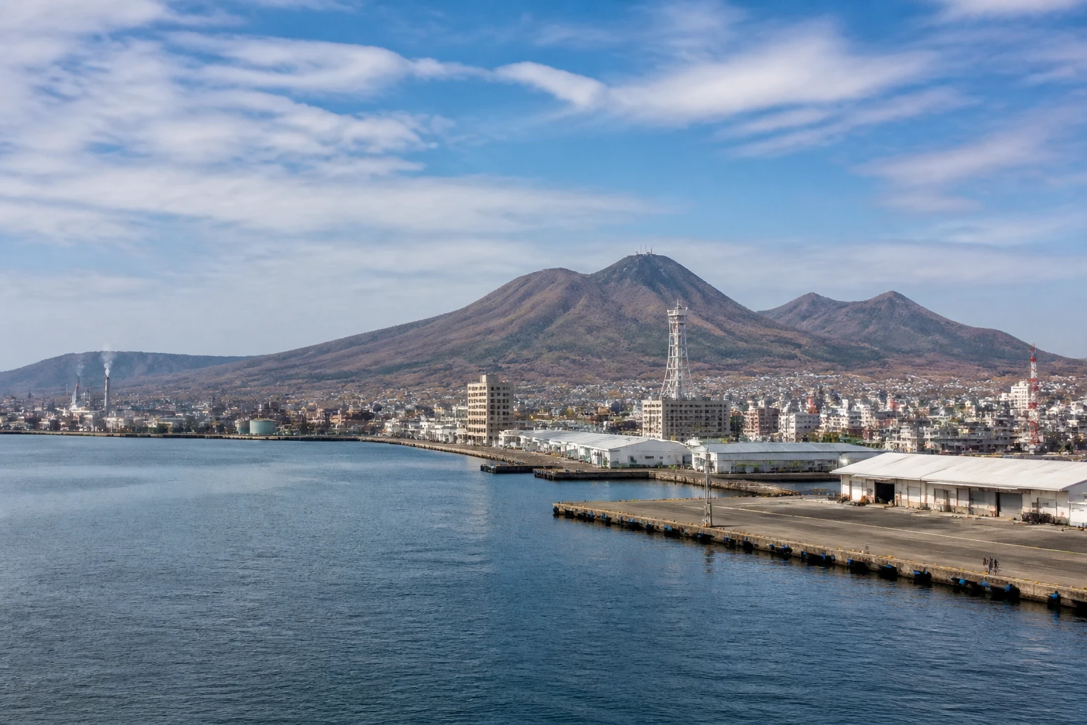 Representative cruise port destination view: Muroran, Japan; passenger waterfront and harbor water, not an exact landmark photograph.