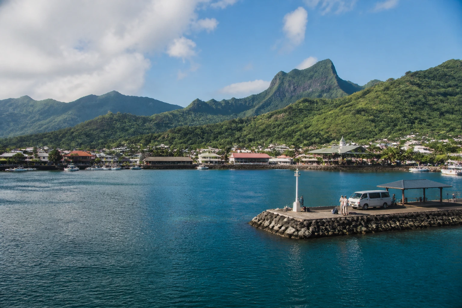 Representative cruise port destination view: Raiatea, French Polynesia; passenger waterfront and harbor water, not an exact landmark photograph.