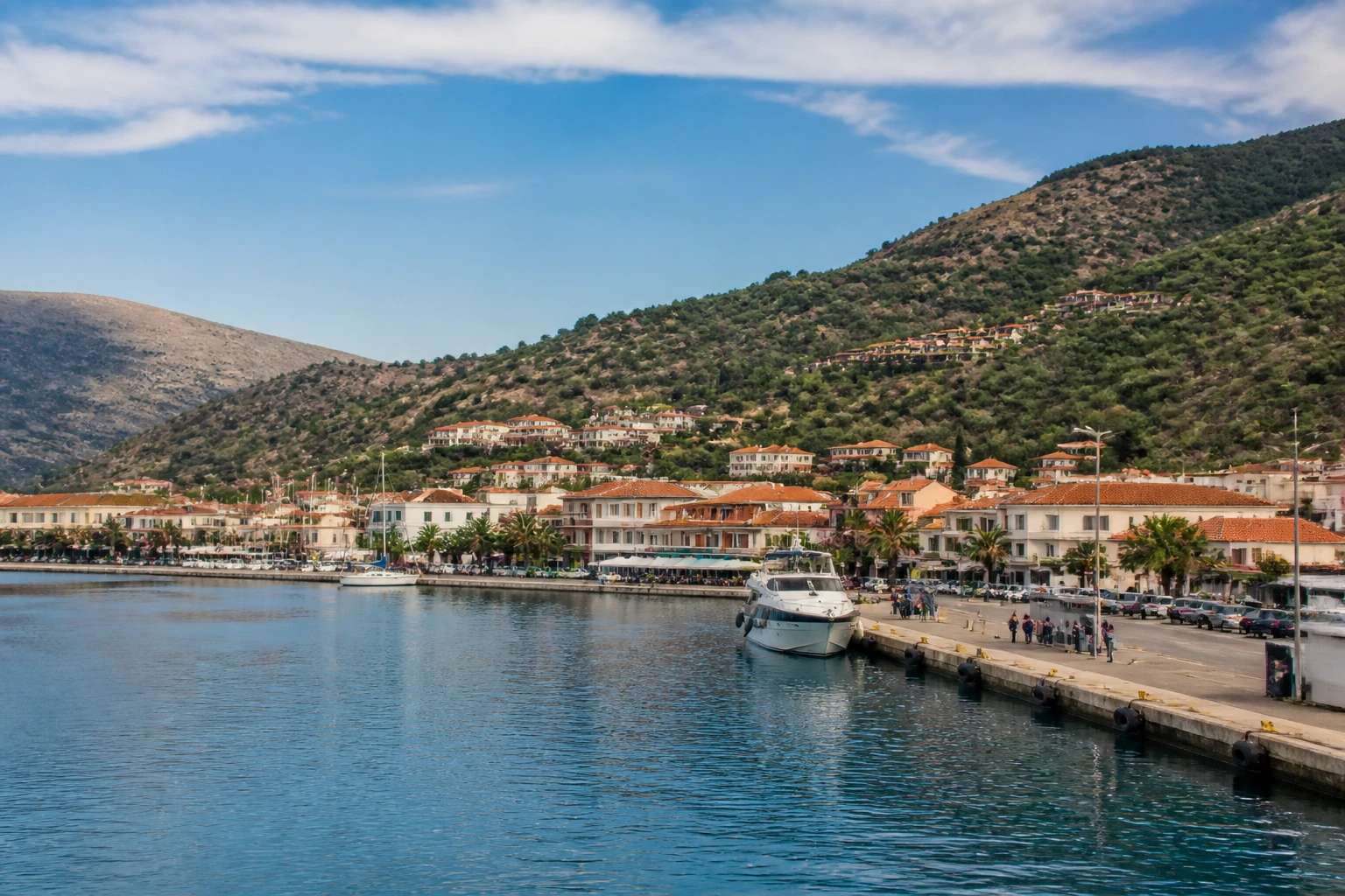 Representative cruise port destination view: Kefalonia, Greece; passenger waterfront and harbor water, not an exact landmark photograph.