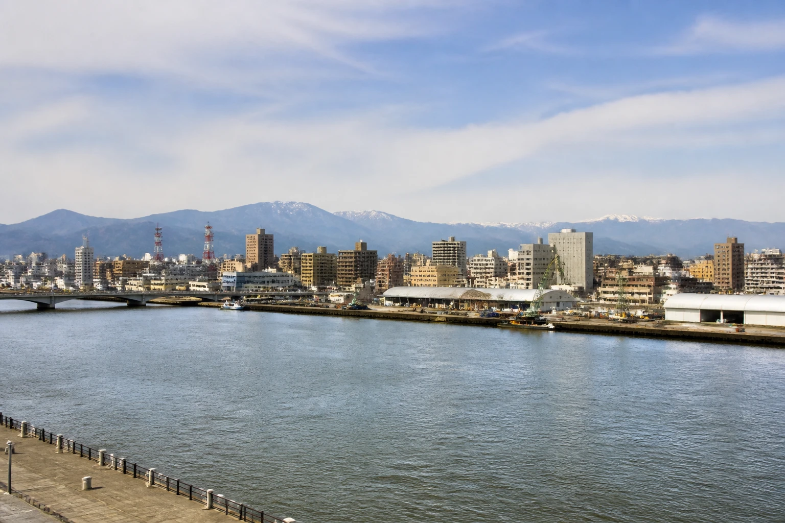 Representative cruise port destination view: Niigata, Japan; passenger waterfront and harbor water, not an exact landmark photograph.